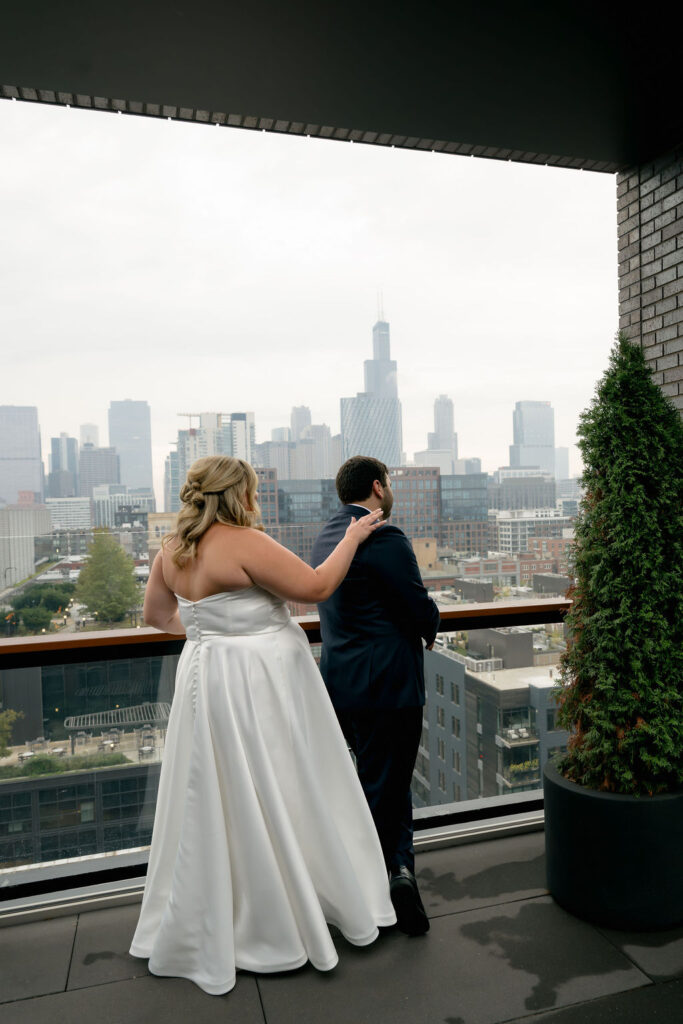 Groom turns to see his bride for the first time during their first look in West Loop, Chicago