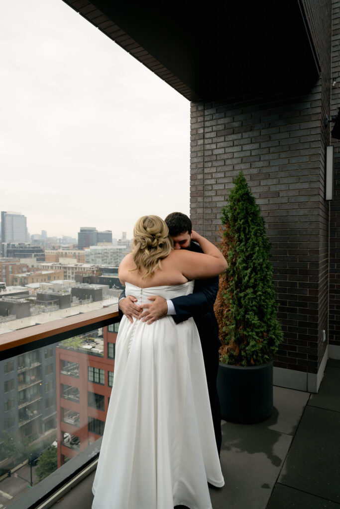 Groom turns to see his bride for the first time during their first look in West Loop, Chicago
