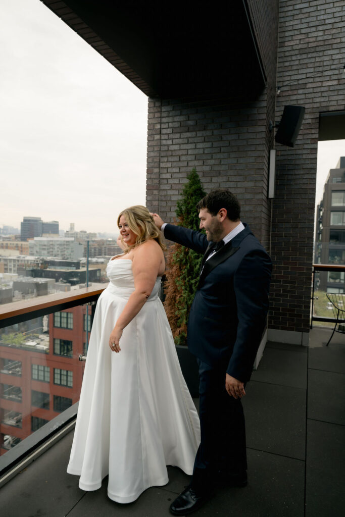 Groom turns to see his bride for the first time during their first look in West Loop, Chicago