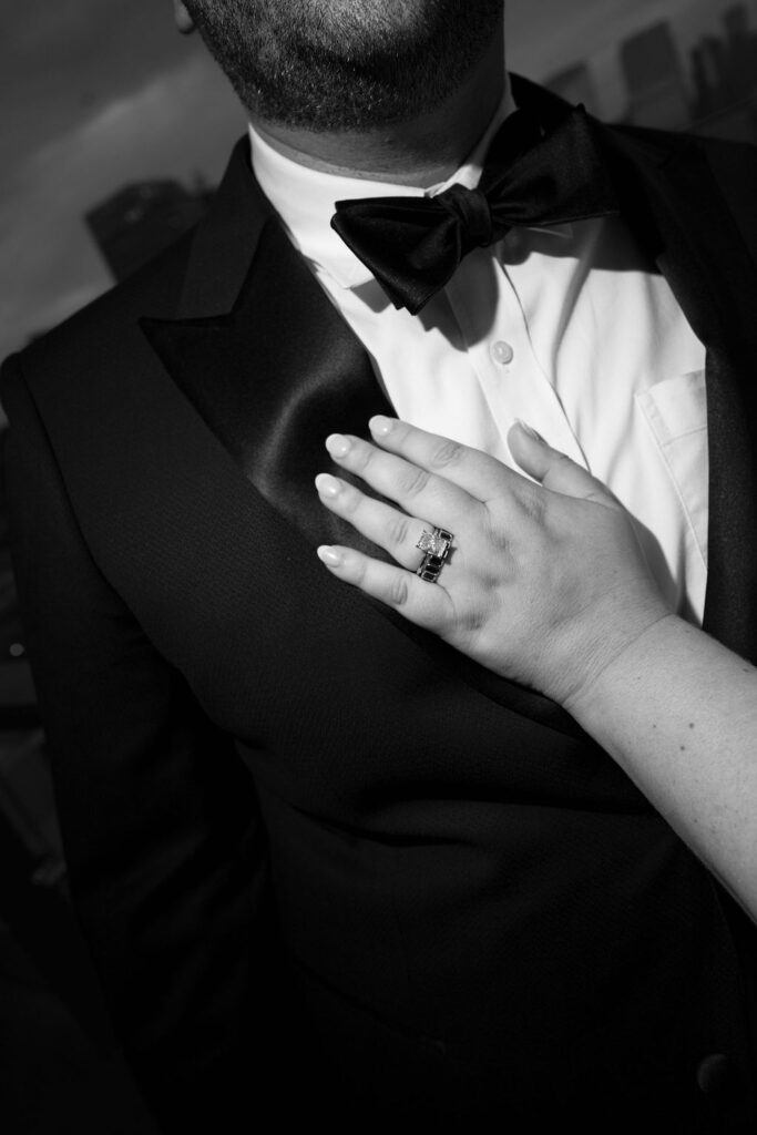 bride ring photo with groom in suit