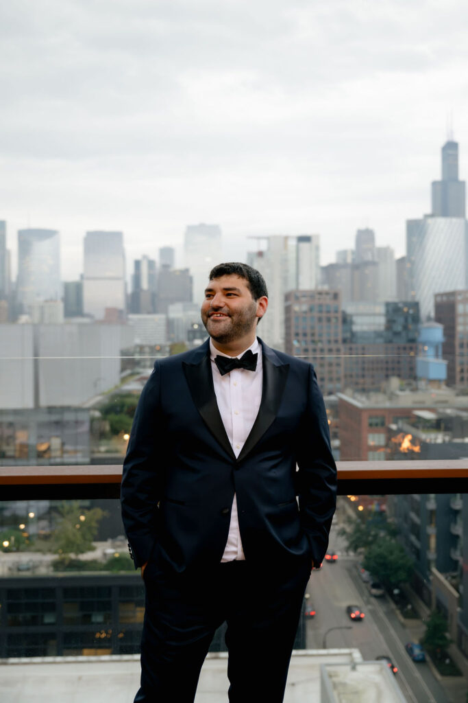 groom Chicago hotel getting ready photos in wedding suit