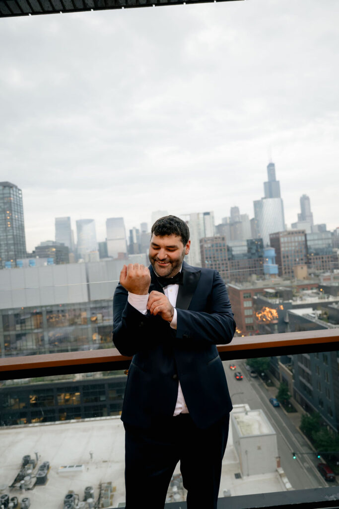 groom Chicago hotel getting ready photos in wedding suit