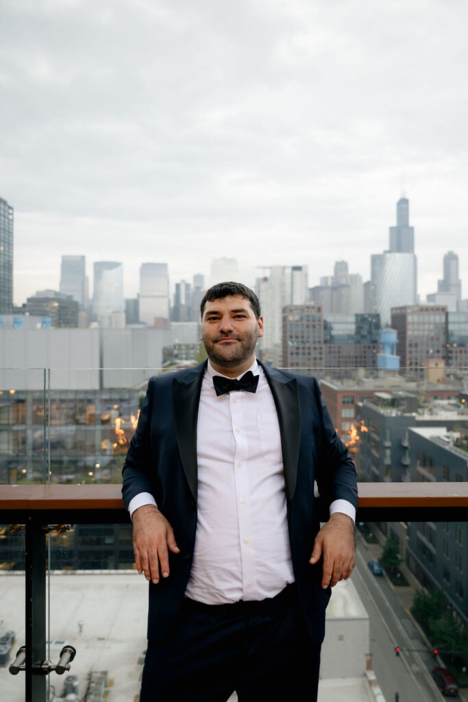 groom Chicago hotel getting ready photos in wedding suit