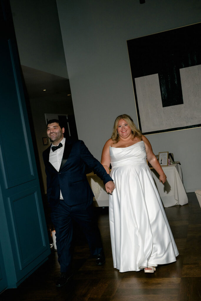 bride and groom wedding entrance reception in chicago at fiorettas in west loop